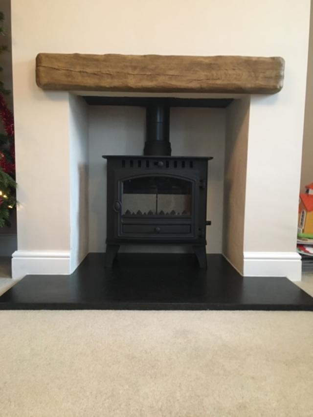 Maidstone install, Arada wood burning stove with wooden beam above