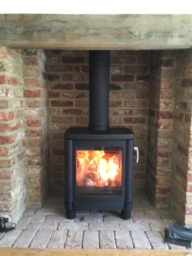 Morso wood burning stove in brick fireplace, Sevenoaks