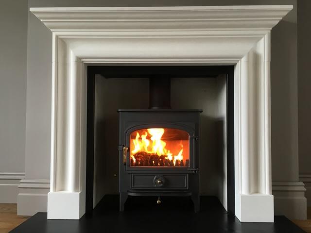 Clearview Vision 500 wood burning stove in limestone fireplace, supplied and fitted Robertsbridge